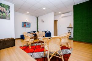 a dining room with a table and chairs at Ideal Residence in Matara