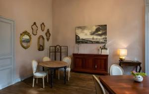 a dining room with a table and chairs at Château Puybarban in Puybarban