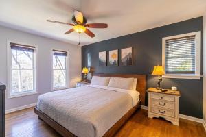 a bedroom with a bed and a ceiling fan at Snaggys Retreat in Boone