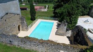 an overhead view of a swimming pool in a castle at Château Puybarban in Puybarban