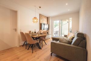 a living room with a couch and a table at Nestzeit in Eben im Pongau