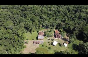 an aerial view of a house in the woods at Drop House Hostel in Ubatuba