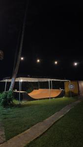 a skateboard ramp in a park at night at Drop House Hostel in Ubatuba +2 photos