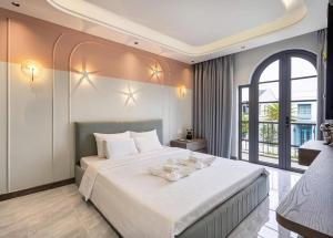 Ένα ή περισσότερα κρεβάτια σε δωμάτιο στο Villa NovaWorld Phan Thiết - 86Home - Biệt thự 4 phòng ngủ - No13334 +6 φωτογραφίες