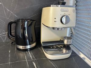 a coffee maker sitting on top of a counter at Видова смарт-квартира в ЖК City Park in Cherkasy +32 photos