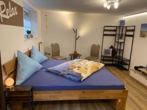 Ένα ή περισσότερα κρεβάτια σε δωμάτιο στο Ferienwohnung-Wieber