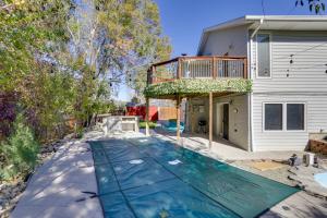 a house with a swimming pool and a deck at 6 Mi to Barr Lake Apt with Hot Tub Access! in Brighton
