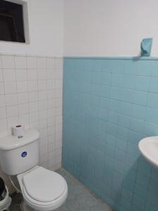 a bathroom with a toilet and a sink at casa la magdalena in La Dorada +15 photos