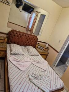 Ένα ή περισσότερα κρεβάτια σε δωμάτιο στο Hotel Puma Chalé +1 φωτογραφίες