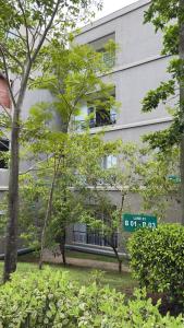 a building with a street sign in front of it at Cozy Clifford Homagama in Homagama