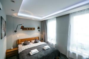 Katil atau katil-katil dalam bilik di Apartament eM klimatyzacja&parking