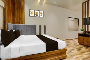 Ένα ή περισσότερα κρεβάτια σε δωμάτιο στο Hotel O The Infinity