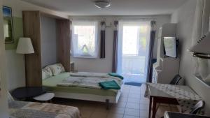 Ένα ή περισσότερα κρεβάτια σε δωμάτιο στο Ferienwohnung Stadler