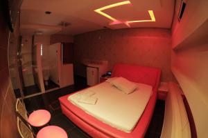 Ένα ή περισσότερα κρεβάτια σε δωμάτιο στο Motel Bentevi