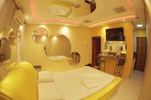 Ένα ή περισσότερα κρεβάτια σε δωμάτιο στο Motel Bentevi