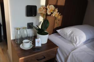 Postel nebo postele na pokoji v ubytování Locale District Boutique Hotel