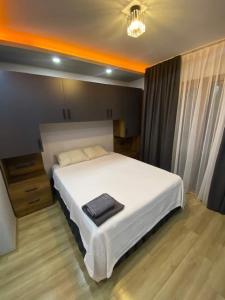 Ένα ή περισσότερα κρεβάτια σε δωμάτιο στο Rezidance Hotel