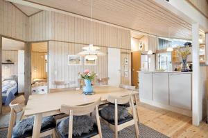 a kitchen and dining room with a table and chairs at SL070-Slagelse-Snerlevej-2 in Slagelse