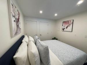 a bedroom with a large bed with white pillows at Waterfront large 1 BR with 6 appliances & gym in Halifax