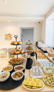 a table with a bunch of food on it at Pantarei Palace in Lettere