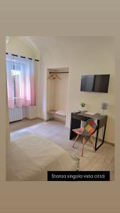 a living room with a desk and a chair at Dimora normanna in Aversa