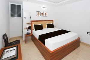 Ένα ή περισσότερα κρεβάτια σε δωμάτιο στο Super Hotel O Deluxe