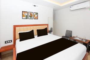 Ένα ή περισσότερα κρεβάτια σε δωμάτιο στο Super Hotel O Deluxe