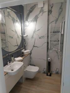 Koupelna v ubytování Apartamenty Pułaskiego + 6 fotografií