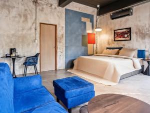 Ένα ή περισσότερα κρεβάτια σε δωμάτιο στο The Arch Casa - Design Hotel Pai