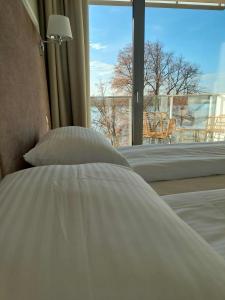 Postel nebo postele na pokoji v ubytování Apartamenty Pułaskiego