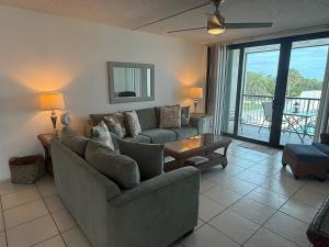 a living room with a couch and a table at Bird of Paradise in Marathon