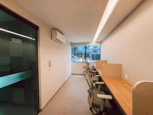 a conference room with a long table and chairs at Flat em Boa Viagem in Recife +26 photos