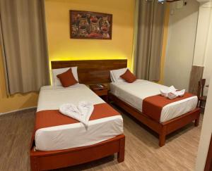 Ένα ή περισσότερα κρεβάτια σε δωμάτιο στο Hotel Yagua