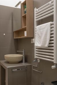 a bathroom with a sink and a mirror at Suite Malu in Naples