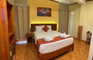 Ένα ή περισσότερα κρεβάτια σε δωμάτιο στο Hotel Yagua +10 φωτογραφίες
