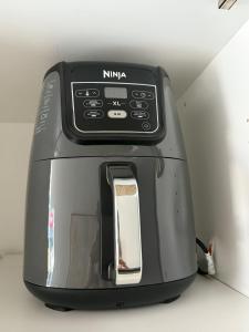 a black toaster is sitting on a counter at Penthouse downtown 1 Bedroom with 6 appliances in Halifax