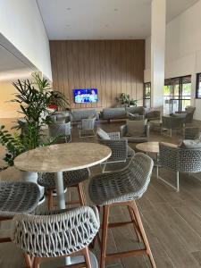 TV a/nebo společenská místnost v ubytování Flat 208 Eco Resort Carneiros