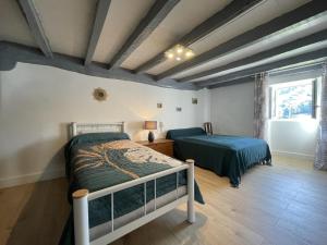 Ένα ή περισσότερα κρεβάτια σε δωμάτιο στο Manexuna