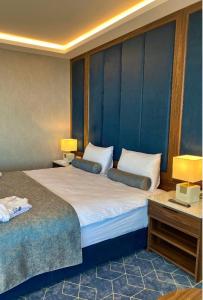 Ένα ή περισσότερα κρεβάτια σε δωμάτιο στο Level Deluxe Hotel