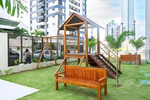 a park with a playground with a slide at Flat em Boa Viagem in Recife