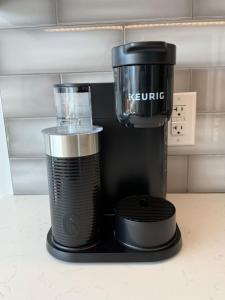 a coffee maker sitting on top of a counter at Bright bold & beautiful 1 BR with 6 applainces in Halifax +17 photos