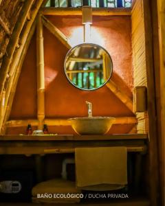 a bathroom with a mirror and a sink at Casa Lorette in Martínez