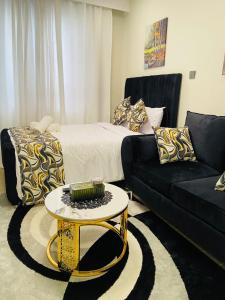 a living room with a couch and a coffee table at Winnie's home in Athi River