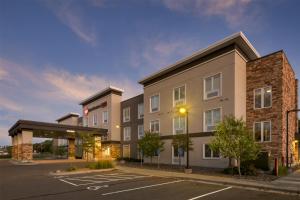 a rendering of a hotel with a parking lot at Best Western Plus Isanti in Isanti