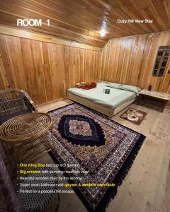 a room with a bed and a chair and a rug at Offbeat Jn in Sukhia Pokhari