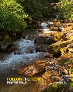 follow the flow find the falls motivational quote next to a river at Offbeat Jn in Sukhia Pokhari