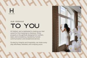 a woman in a dress looking out of a window at French's Luxury Condo - Steps from Broadway in Nashville