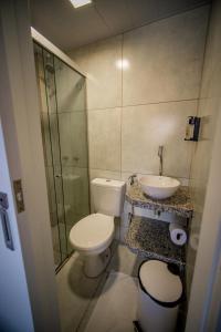 a bathroom with a toilet and a sink at Amazinn Hotel in Belém