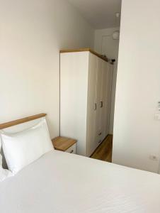 Ένα ή περισσότερα κρεβάτια σε δωμάτιο στο Tirana Luxe Apartments 3