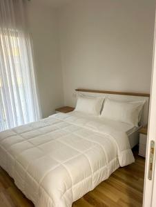 Ένα ή περισσότερα κρεβάτια σε δωμάτιο στο Tirana Luxe Apartments 3